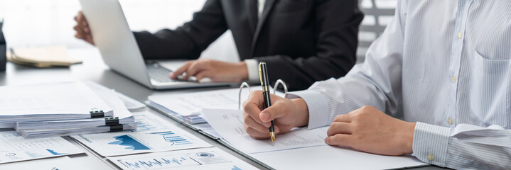 Auditor team collaborate in office, analyzing financial data and accounting record. Expertise in finance and taxation with accurate report and planning for company revenue, expense and budget. Insight