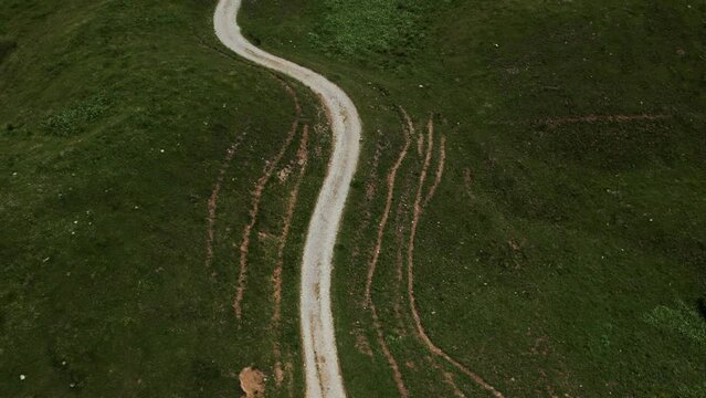 Aerial view from a drone of the Crocedomini Pass in Lombardy. Majestic landscape of the Alps on a sunny day with passing clouds.