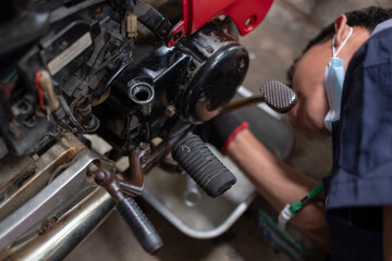 Fototapeta premium Refueling and pouring oil quality into the engine motorcycle Transmission and Maintenance Gear. Energy fuel concept.