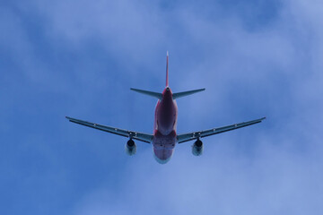 Airplane in the cloudy sky.