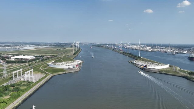 The Maeslantkering is a storm surge barrier that was commissioned in 1997 on the border of Het Scheur and the Nieuwe Waterweg near Hoek van Holland.