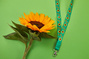 Sunflower lanyard, symbol of people with invisible or hidden disabilities.