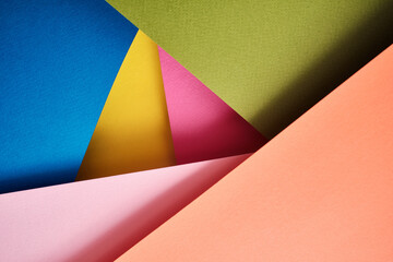 Abstract texture of colored paper. Geometric shapes and lines in bright colors. Place for text. Multicolor abstract flat lay. Back to school concept. Copy space, top view