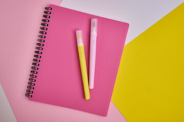 Top view of blank notepads, pen and markers. Mockup. The concept of office and school supplies, school year