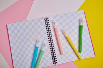 Top view of blank notepads, pen and markers. Mockup. The concept of office and school supplies, school year