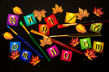 all zodiac signs in various colors with colorful autumn leaves like romantic artistic astrology and autumn season concept 