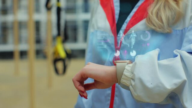 Close up of young woman in the sport ground check health indicator and heart rate on smartwatch. Future technology concept of humanity. 3D render animation.