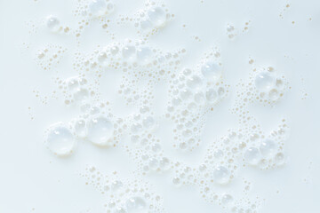 macro milk texture,White surface of milk and bubbles and ripples from above birds eye view