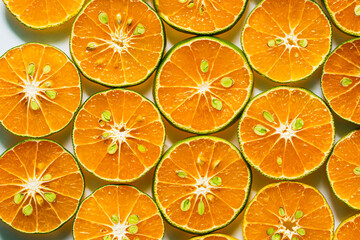 macro orange,Abstract background of orange citrus slices on white.
