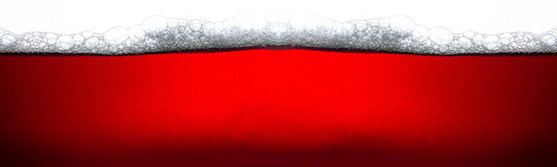 Cola macro texture isolated white background,Side view background of refreshing cola soda with bubbles and ice, isolated on white.