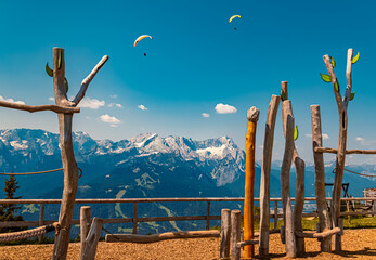 Alpine summer view with paragliders and a kids playground at Mount Wank, Garmisch-Partenkirchen,...