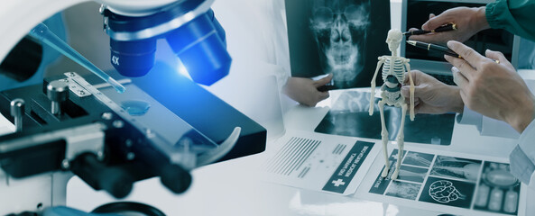 Medicine doctor touching on digital tablet and hologram modern virtual screen interface icons, Medical technology and futuristic concept.