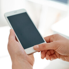 Instant messaging suits her business needs. Cropped shot of an unrecognizable businesswoman using her smartphone inside of an office.