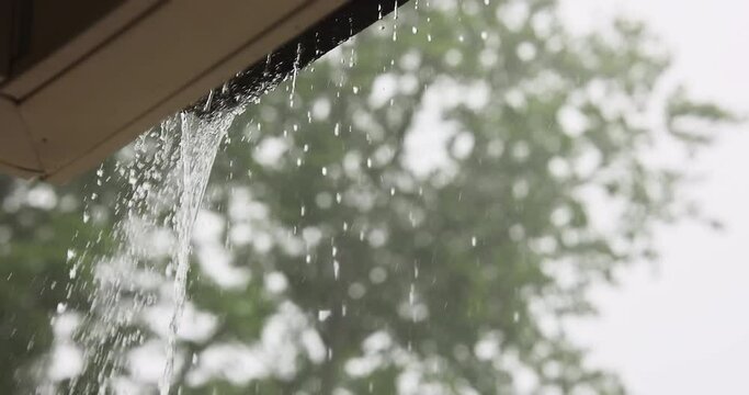 When it rains heavily, water pours out of over gutters.