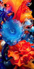 Colorful Glass Sculpture with Blue, Orange, and Red Flowers