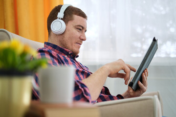Unwind and Enjoy: Freckled Redhead Finds Serenity with Music and Podcasts. Evolution of Digital Music Consumption: Discovering the Joy of Streaming Services