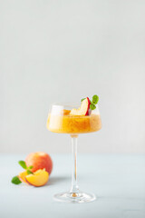 Frozen Peach Bellini Cocktail. Summer cold alcoholic drink