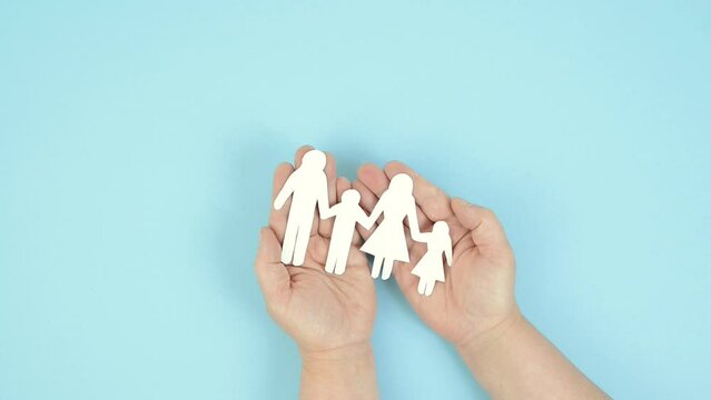 Parents with one child holding hands, relationship in family, care and security concept, charity and insurance, paper cut out
