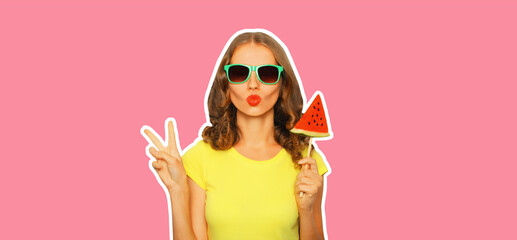 Summer portrait of stylish young woman with fresh juicy lollipop or ice cream shaped slice of watermelon wearing sunglasses on pink background