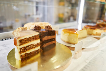 Chocolate cake with strawberries. fresh pastries with berries. A variety of fresh pastries in the bakery window. Strawberry cake. The interior of an Italian restaurant.