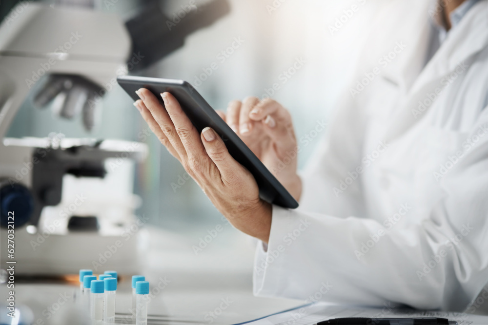 Aufkleber Making a record of her research. Cropped shot of an unrecognizable mature female scientist using a tablet while doing research in her lab.