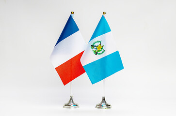 National flags of France and Guatemala on a light background.