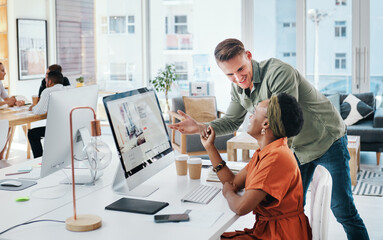 When great minds come together, so do great things. Cropped shot of two young business colleagues having a discussion and working on a computer together in the office.