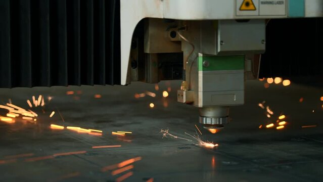 Modern metal laser cutter in action. Creative. Metalworking industry technologies.