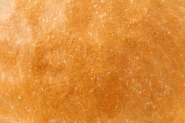 Velours gordijnen Brood Baked bread crust, close-up surface, uniform texture background  © elenvd