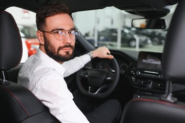 transportation, vehicle and people concept - male car driver looking at passenger on back seat