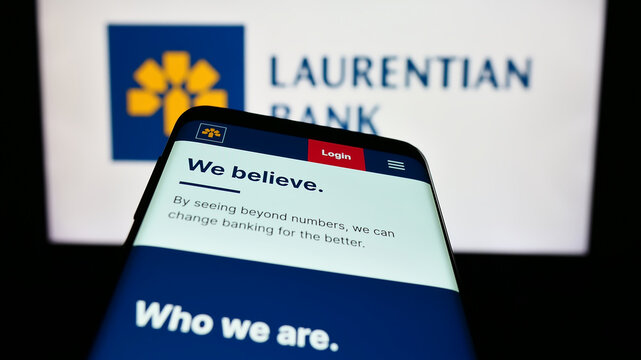 Stuttgart, Germany - 07-15-2023: Mobile phone with website of financial company Laurentian Bank of Canada (LBC) on screen in front of logo. Focus on top-left of phone display.