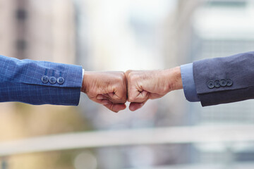 Fist bump, business people and motivation of staff with success, agreement and partnership. Team...
