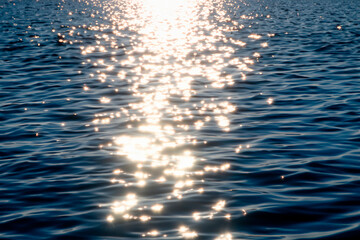 Baltic sea water surface with waves and sun glare reflection. 