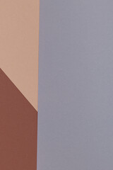 Multicolor background from a paper of different shades of brown and gray. Geometric backdrop.