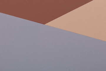 Multicolor background from a paper of different shades of brown and gray. Geometric backdrop.