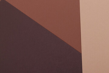 Multicolor background from a paper of different shades of brown. Geometric backdrop.