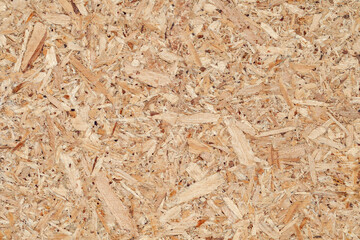 Chipboard plywood yellow close-up, uniform texture background