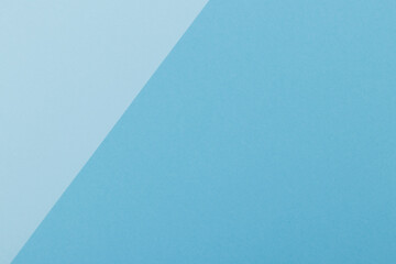 Multicolor background from a paper of different shades of blue. Geometric backdrop.