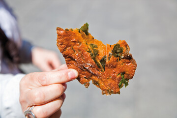 Hand holding a crespillo. Sweet pastries traditional Aragonese festival