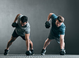 Fitness, men and dumbbell push up for exercise with focus, power and strong muscle with a grey...