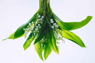 Bouquet of Lily of the valley on a light background.