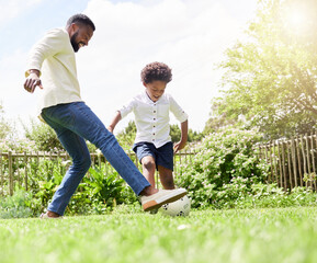 Soccer, dad and happy kid on a garden with exercise, sport learning and goal kick together. Lawn, fun game and black family with football on grass with youth, sports development and bonding on field