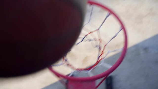 top view basketball ball is thrown into the hoop