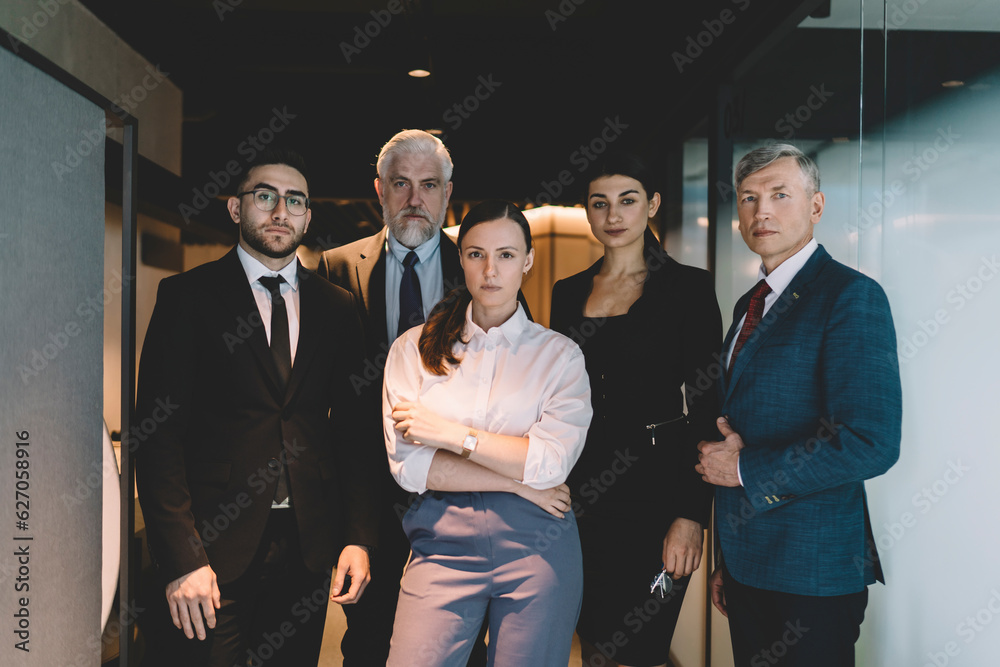 Wall mural Group of confident colleagues standing in office