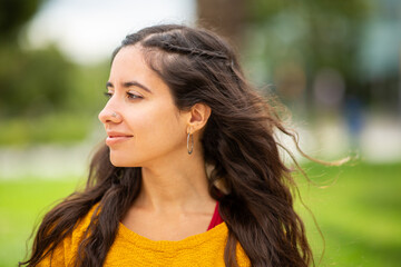 Fototapeta premium Side of beautiful young woman looking away