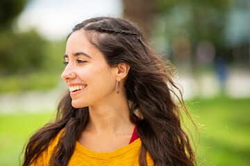 Fototapeta premium Close up side of smiling young woman