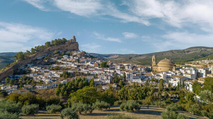 Fototapeta na wymiar Montefrio. Panoramic aerial view of dome, white village and church on the cliff. One of the most beautiful views in the world according to National Geographic. Granada. Spain.