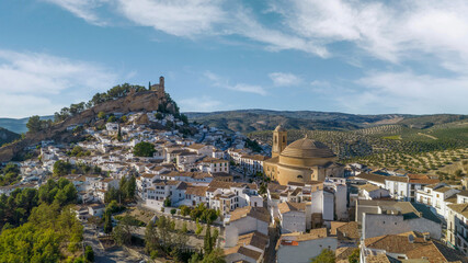 Montefrio. Panoramic aerial view of dome, white village and church on the cliff. One of the most...
