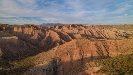 Gorefe desert. Panoramic aerial view of canyons, badlands, dusty road and rocky desert. Uninhabited...