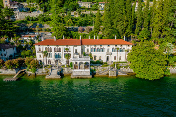 Fototapeta na wymiar Aerial panoramic view of touristic villa Monastero located in Varenna resort, on the shore of lake Como, Lombardy region, Italy